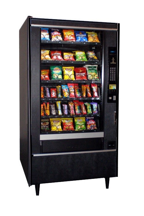 Crane National 157 glass-front snack vending machine full of chips and bars
