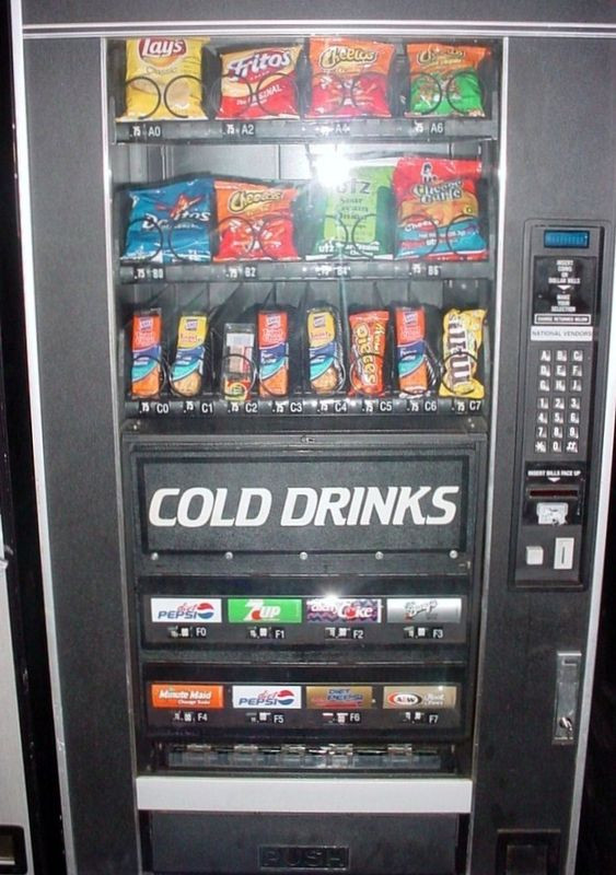 Crane National combo vending machine with chips on top and cold drinks below
