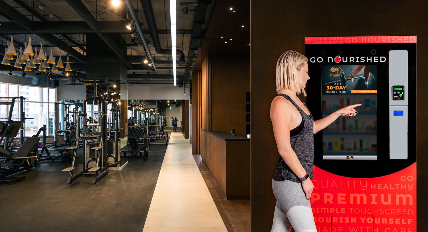 Go Nourished vending machine beside the entrance of a fitness centre